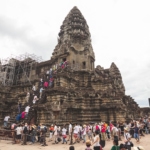 A crowd of tourists lines up at Angkor Wat in Siem Reap, Cambodia