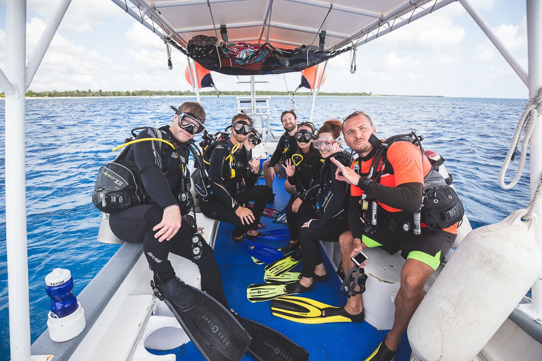 Scuba Tony Cozumel Group of scuba divers posing for a photo on a dive boat. Scuba Tony