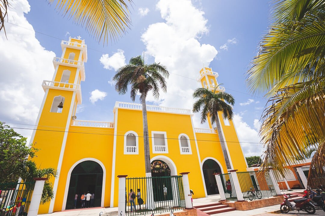 Corpus Christi Cathedral The Cathedral of Corpus Christi surrounded by palm trees in Cozumel, Mexico